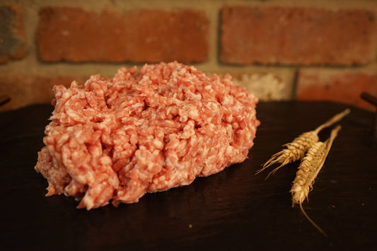 A small portion of Pork Mince on a slate chopping board 