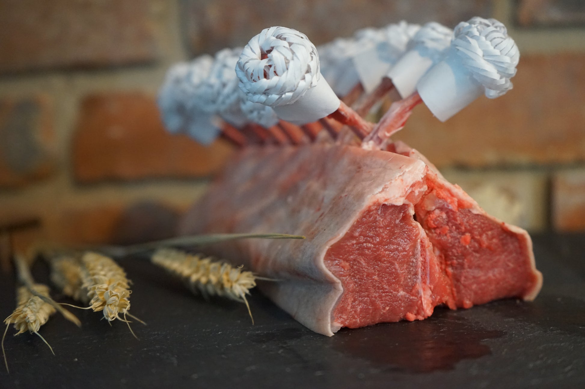 A Rack of Lamb on a slate chopping board